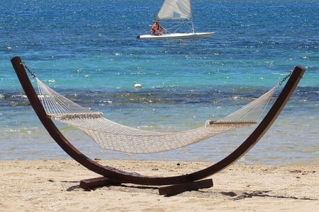 2 person hammock with wooden stand on beach